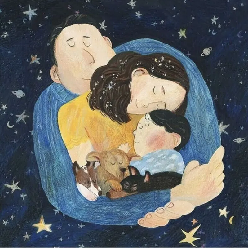 Cuddle là gì: Một người đang ôm một đứa bé ngủ trong tay, thể hiện sự âu yếm và an toàn.