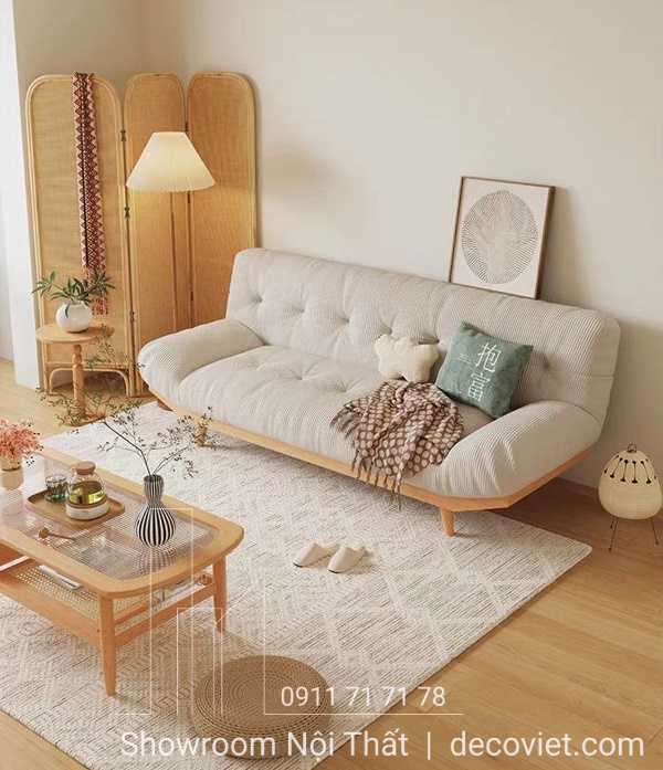 Một chiếc sofa bed màu xám được đặt trong không gian sống đơn giản, thể hiện tính năng linh hoạt và tiết kiệm không gian, phổ biến tại các cửa hàng bán ghế sofa TPHCM.